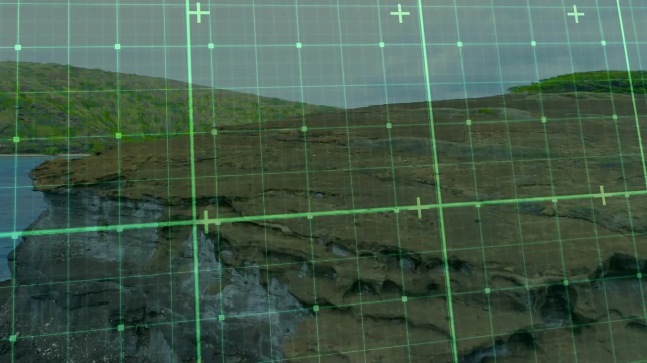 Grid overlay initiating scan, drifting down rocky cliff and ocean waves, highlighting rock layers