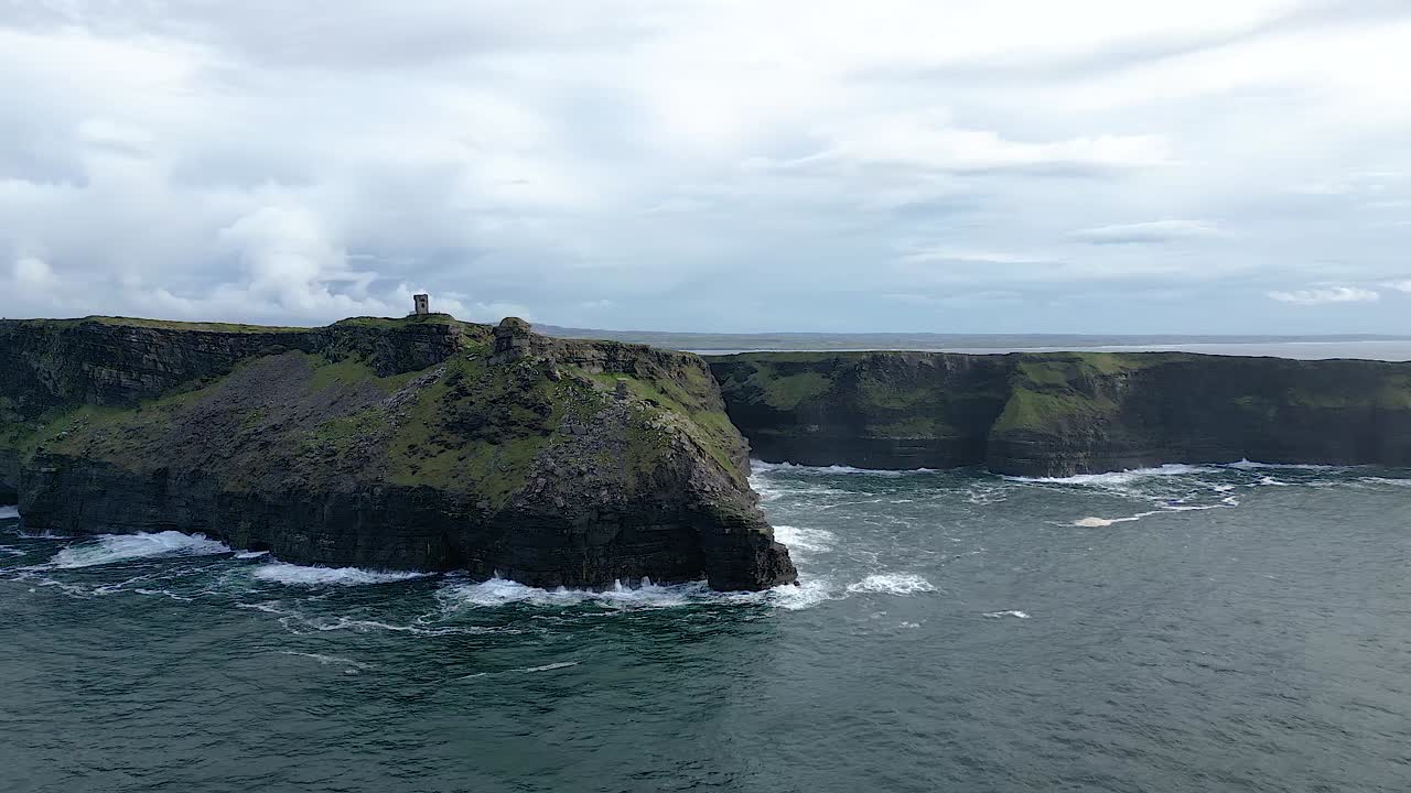 Amazing aerial view of Moher Tower at Hag's Head and Ireland Cliffs at sunset