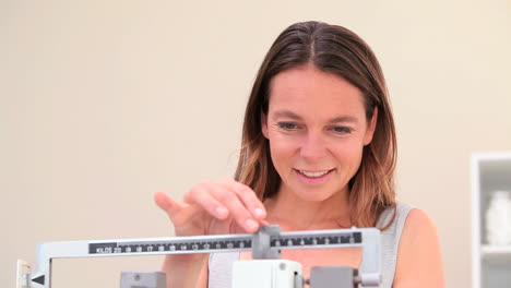 woman weighing herself