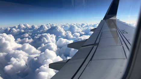 airplane flight over cumulus clouds