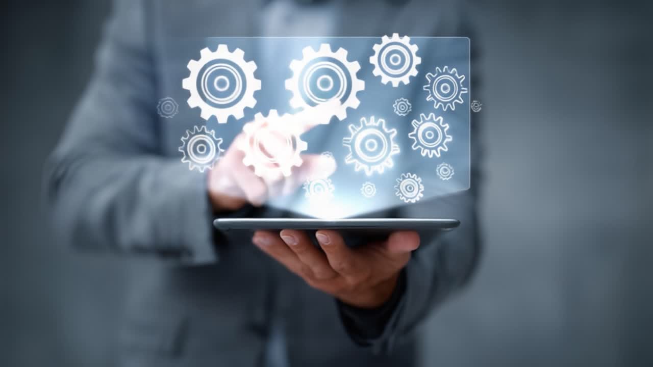A Professional Engaged in Digital Interaction with Gears Illustrating Mechanisms on a Tablet, Representing Innovative Technology and Automation Concepts in Modern Workflows