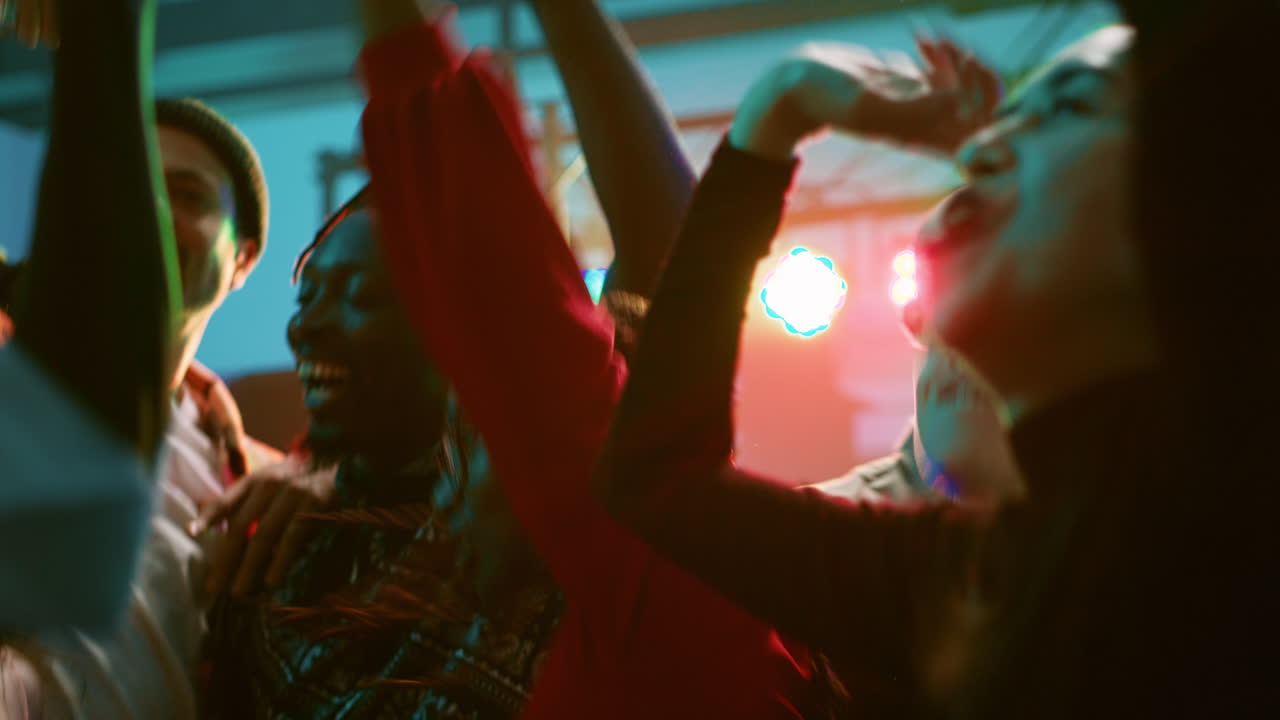 Excited crowd celebrating at a vibrant party or concert