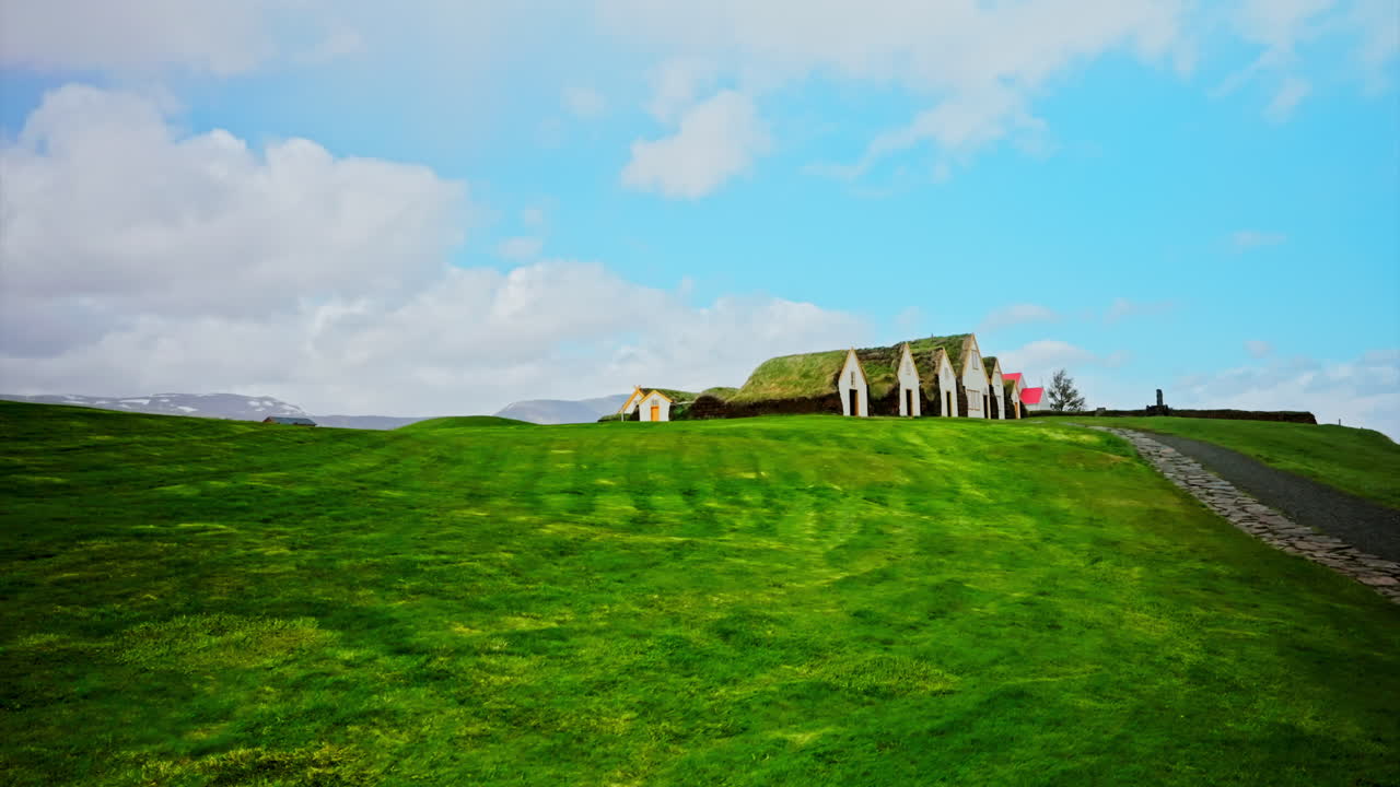 Traditional Icelandic houses with grass on the roof. Glaumbær Farm and Museum. Three Turf houses in Iceland with a grass roof. A traditional sod roof house. Iceland houses.