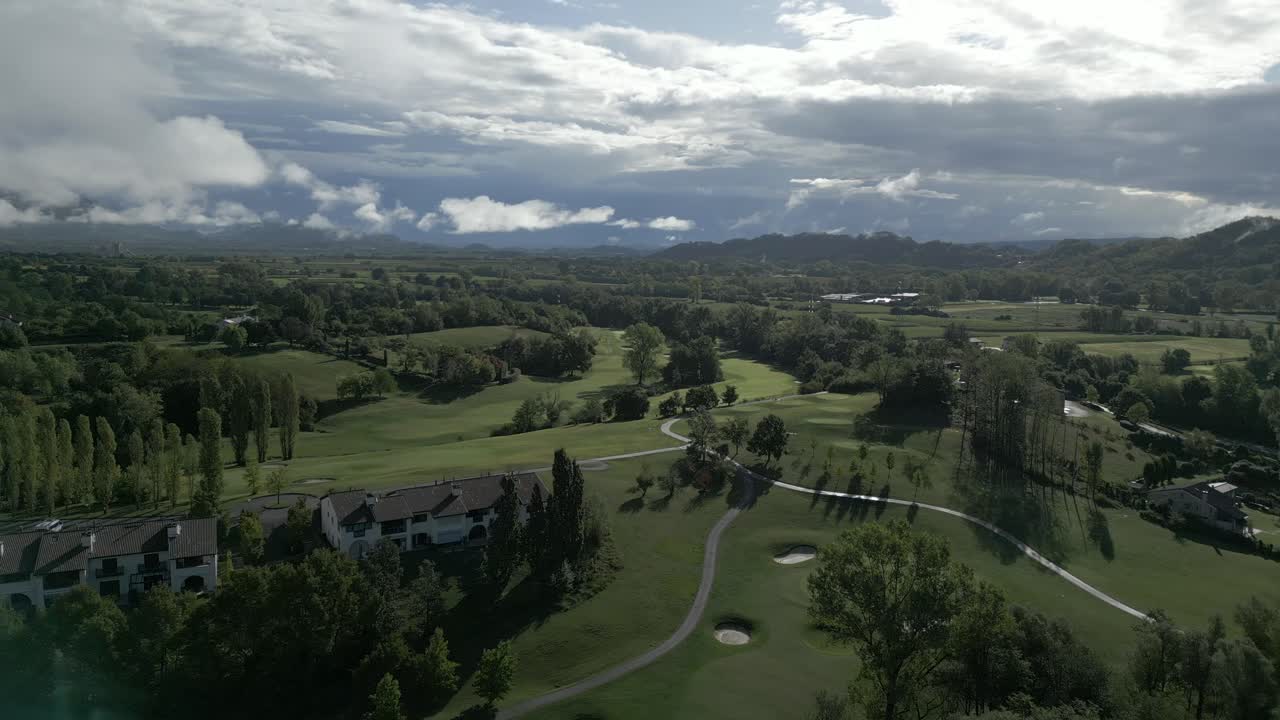 Aerial View of a Lush Golf Course in a Picturesque Valley