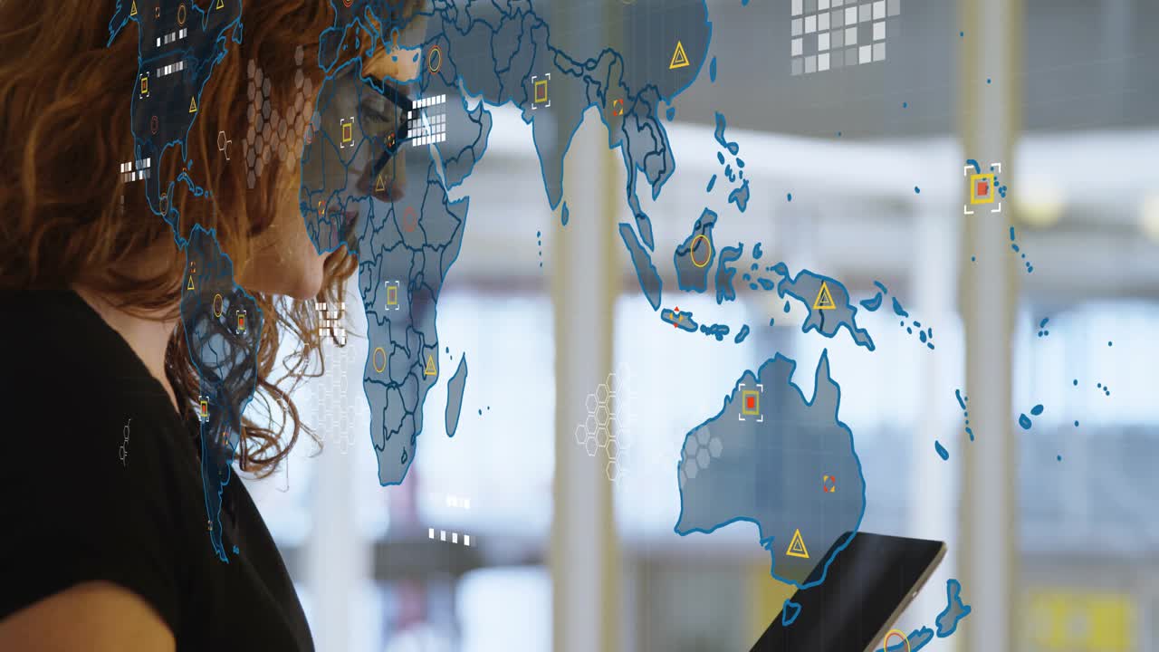 Woman tapping tablet in office, starting evolving map anchoring to tablet and analyzing tech data