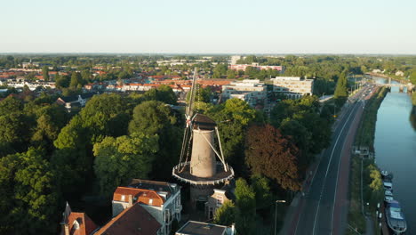 Aerial-Drone-View-Of-Hollandsche-IJssel-River-With-'t-Slot-Mill-In-Gouda,-Netherlands