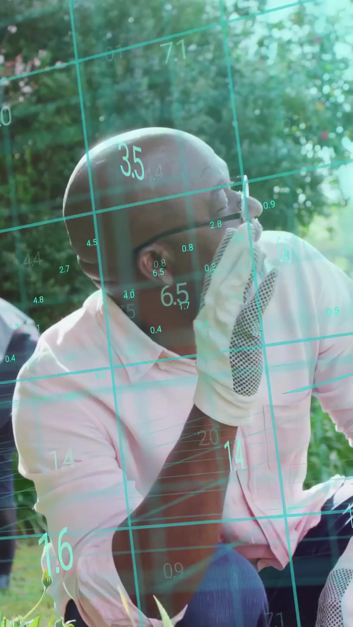 Vertical video: Man gardening pot, reacting to offscreen cue, donning glove as teal grid annotating