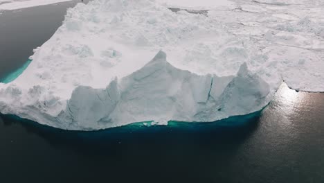 drone over sea and ice of ilulissat icefjord