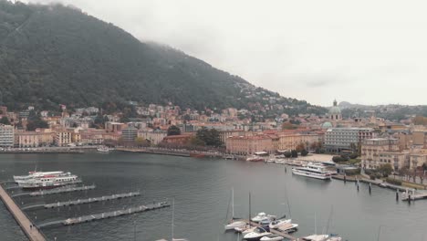 Yachts-and-motorboats-at-picturesque-Como-lake-marina,-Lombardy,-Italy