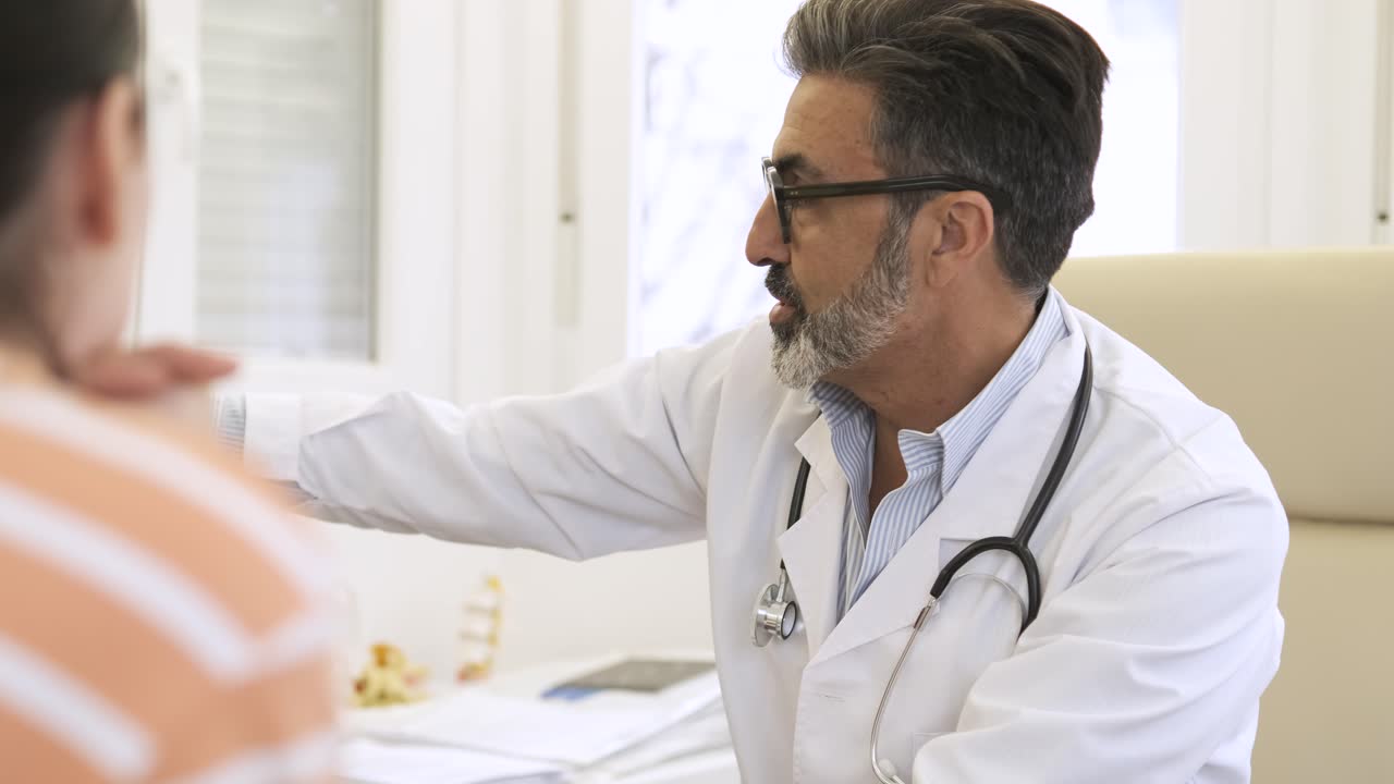 Doctor and patient discussing health problems | Premium Stock Video Footage