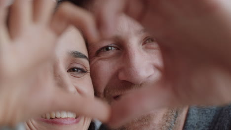 happy couple making heart shape with hands gesturing romantic commitment enjoying loving relationship on valentines day