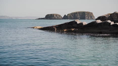 View-of-rocks-and-small-island,-Irish-coastal-scenery