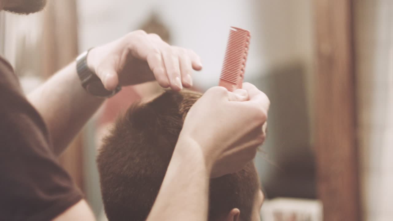 Barber finish hair style. Man hairstyle. Hairdressing salon. Hairstylist working