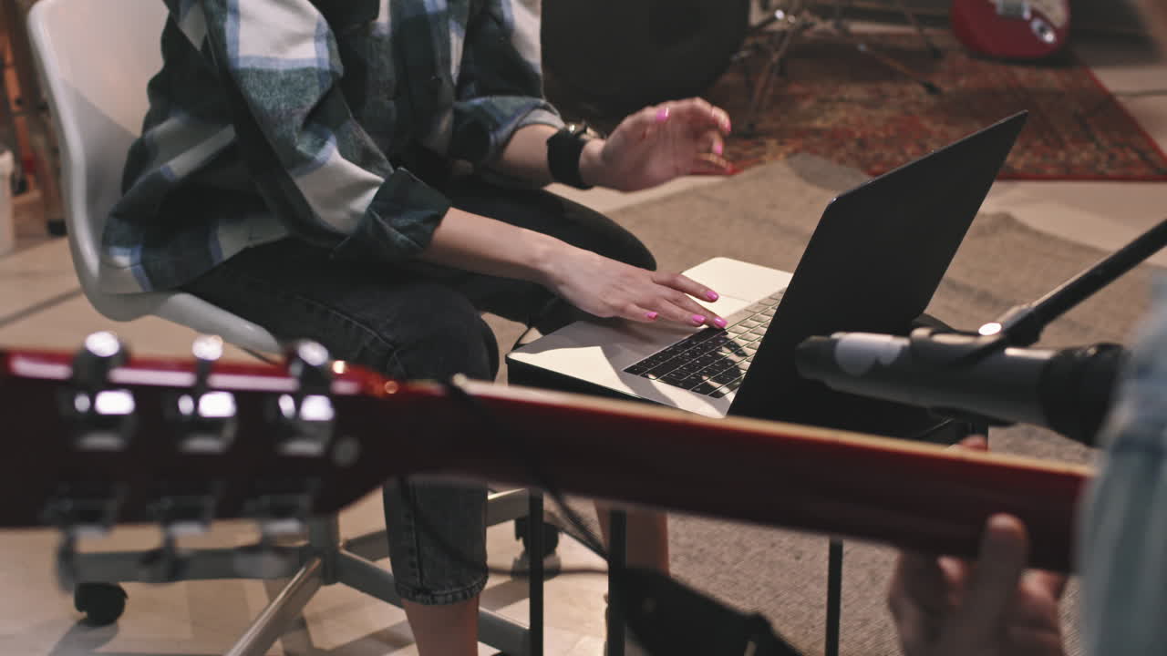 Female Musicians Recording Music In Studio