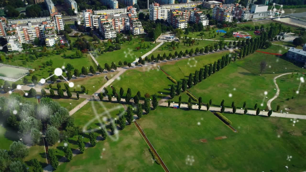 animación de conexiones que se mueven sobre vista aérea del parque y la ciudad moderna