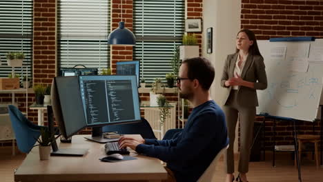 software developers collaborating and discussing in an office environment