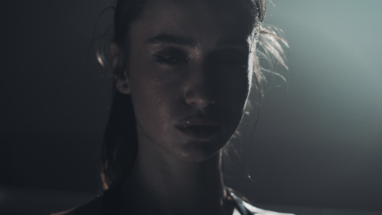 Close-up portrait of a sweating woman after intense physical activity