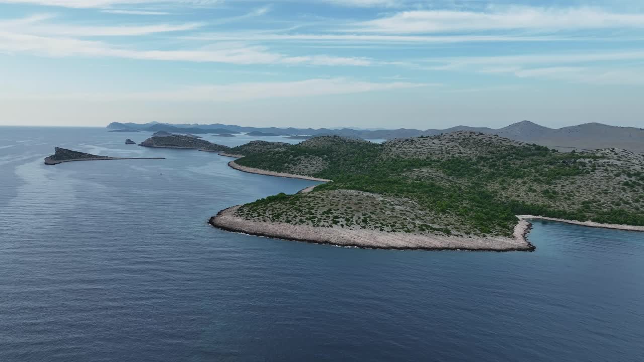 Hilly green islands in Kornati archipelago in Croatia, aerial pull-out