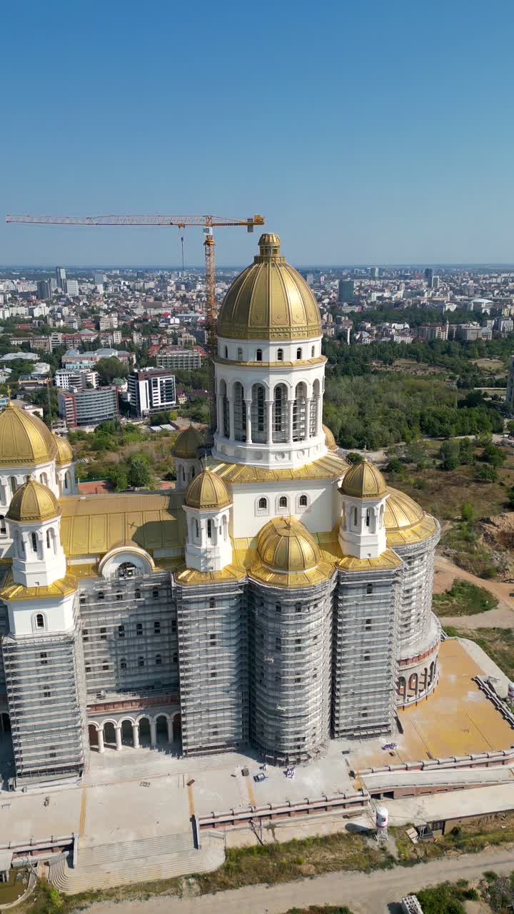 Aerial perspective of People's Salvation Cathedral in building process. Located in central Bucharest on Spirea's Hill, the same as the Palace of Parliament. Drone circling around the Cathedral. Travel