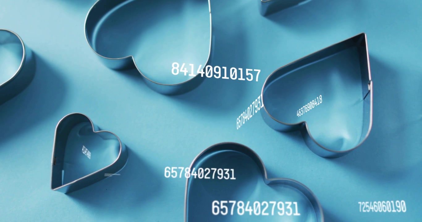 Static overhead view starting numeric strings appearing above steel heart cutters showing data flow