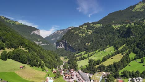 village in switzerland, aerial drone over swiss alps mountains valley, nature