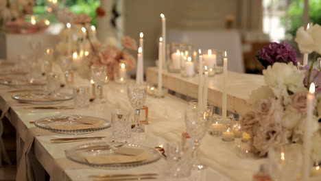 candles illuminate a luxurious dining experience at a traditional indian wedding