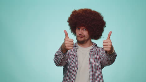 tourist stylish man in shirt showing thumbs up and nodding in approval, successful good work