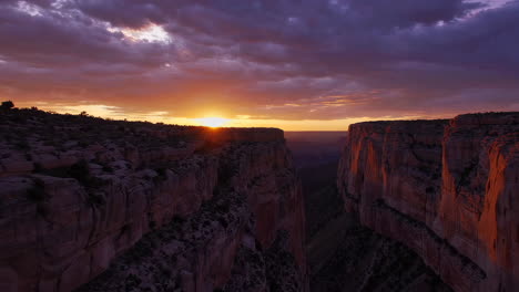 dramatic sunset over a grand canyon landscape
