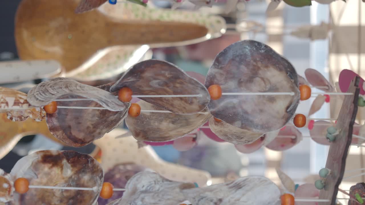 Close-up of Seashell Hanging Decorations with Colorful Beads