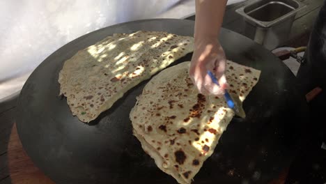 turkish flatbread. close - up cook prepares delicious cakes with stuffing.