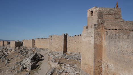 ancient stone walls of castillo de gormaz under a clear blue sky in soria, spain