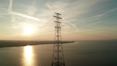 high voltage line tower on a sunny evening
