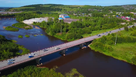 aerial view of a river, bridge, and town