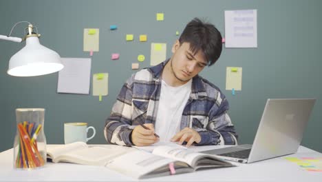 Male-student-looking-at-camera-with-positive-and-positive-gesture.