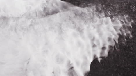 blending of white ink with black ink forming shimmering galaxy. closeup shot