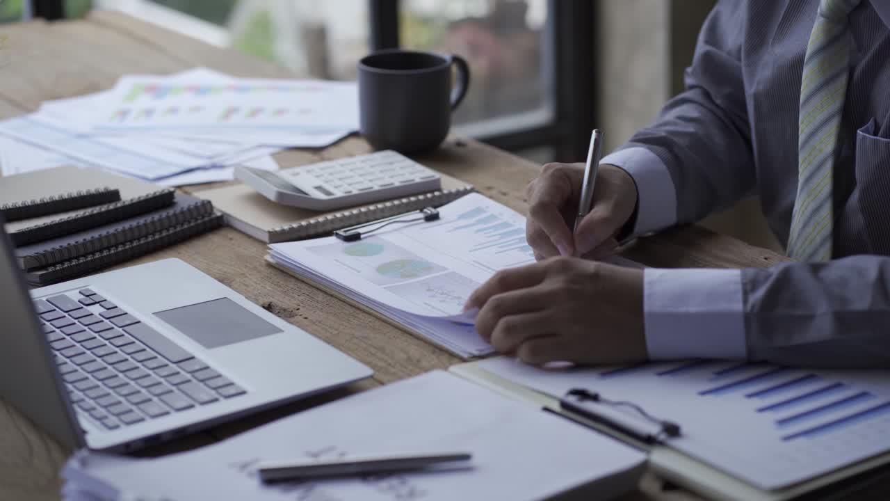 Business people develop business projects and analyze market data working in the office with business reports and stock analysis documents. paperwork concept