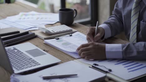 business people develop business projects and analyze market data working in the office with business reports and stock analysis documents. paperwork concept