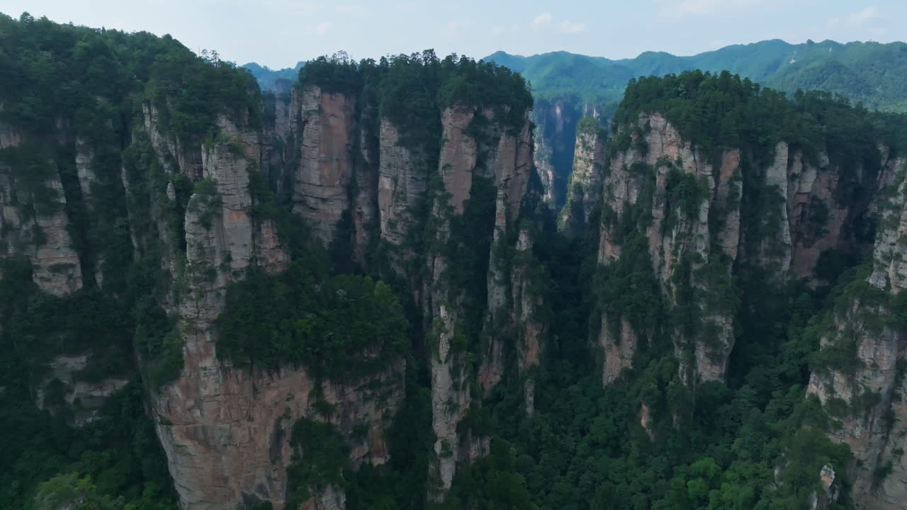 Aerial view rotating rocky Zhangjiajie's Avatar Mountains, summer in China