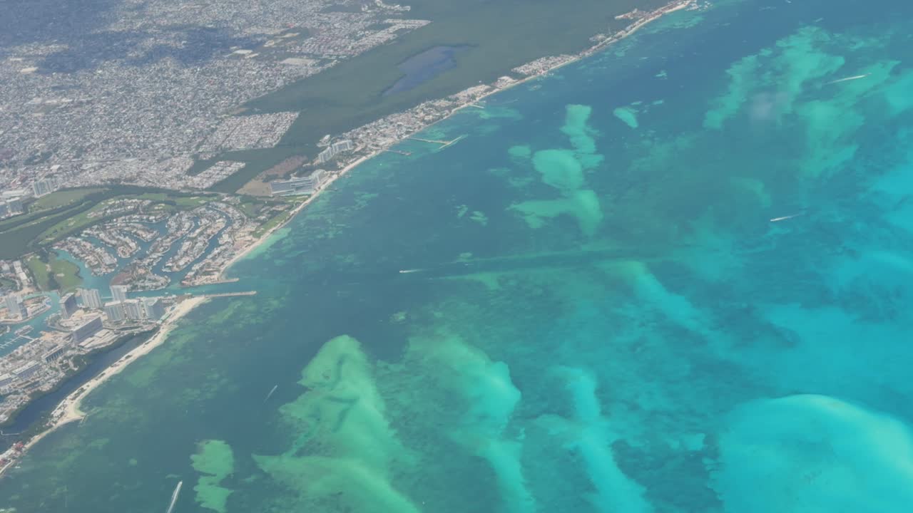 Turquoise sea along luxurious beach resort coastline aerial