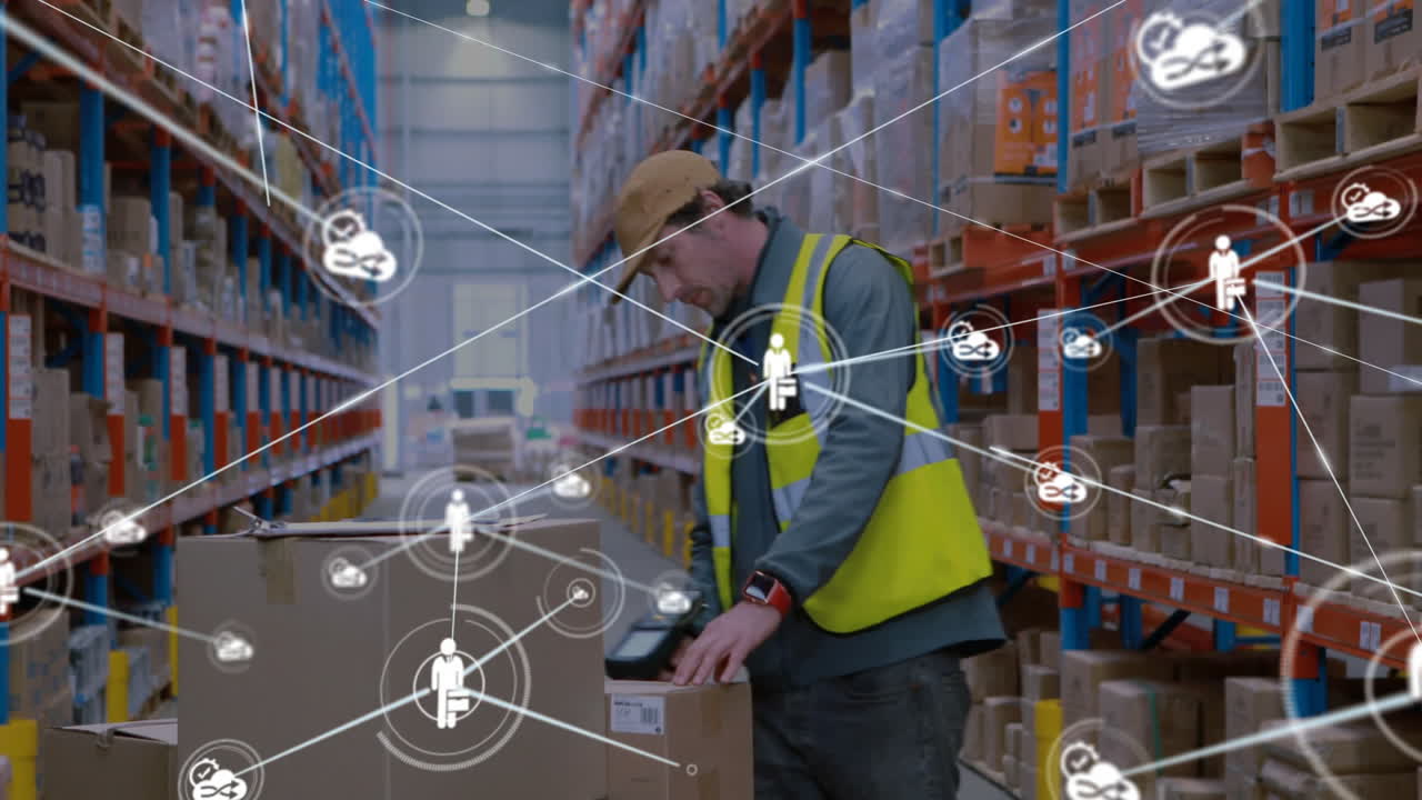 Scanning boxes, warehouse worker using digital network connections for inventory