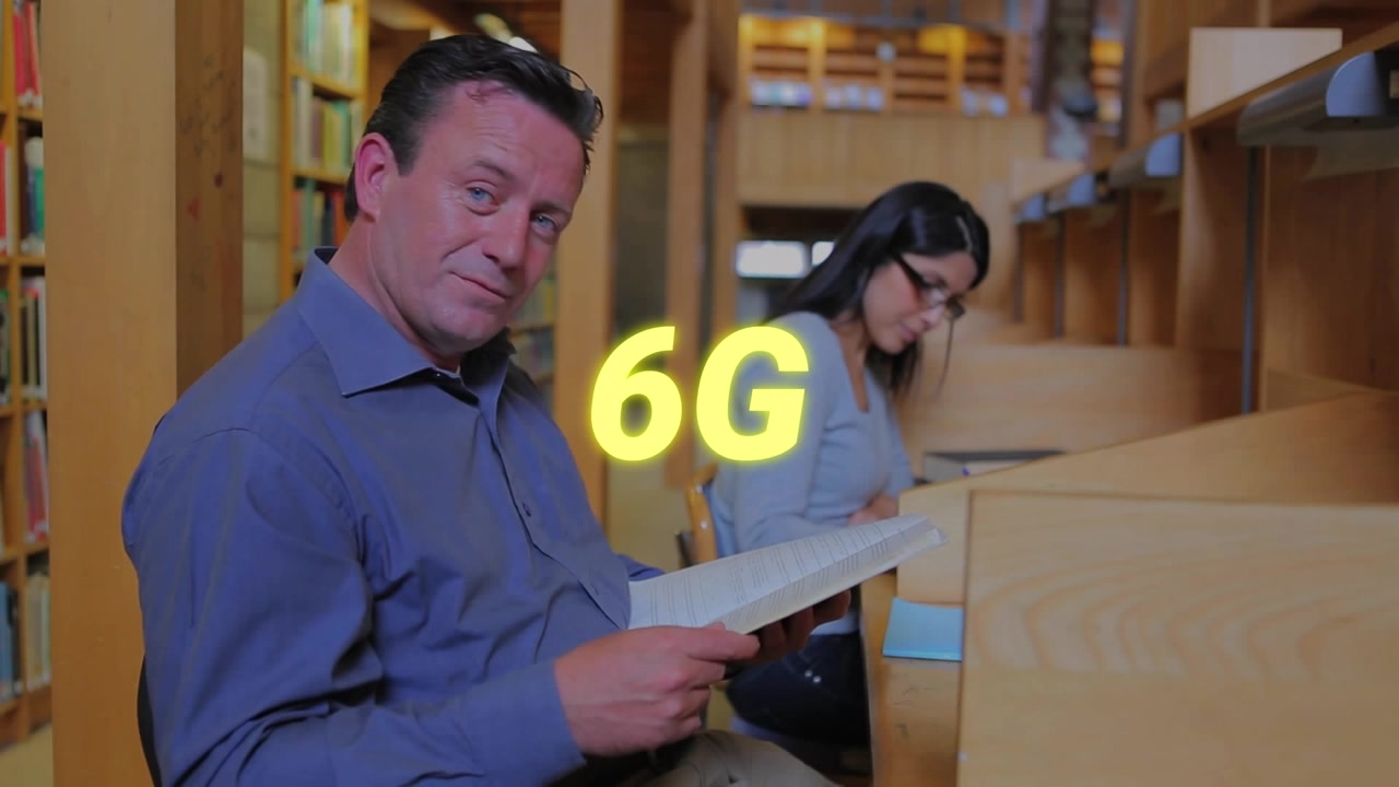 Animation of 6g text banner over caucasian male professor reading a book in the library at college