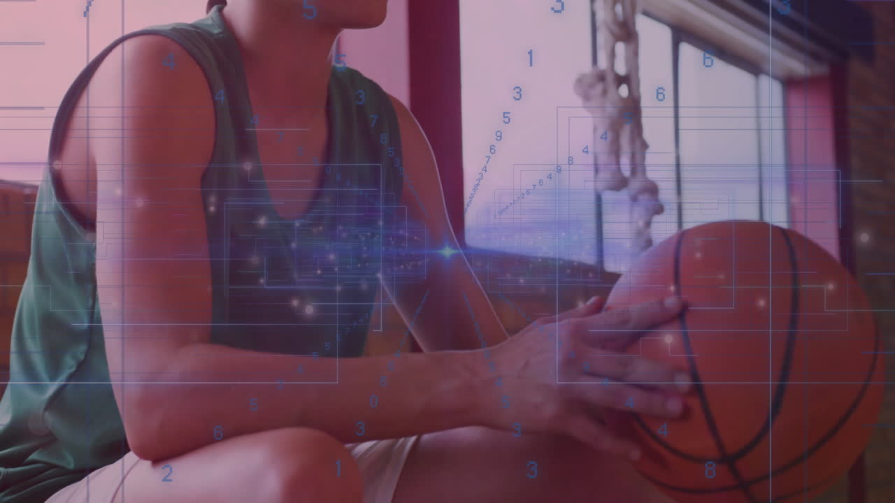 Basketball player holding ball with digital data processing animation overlay