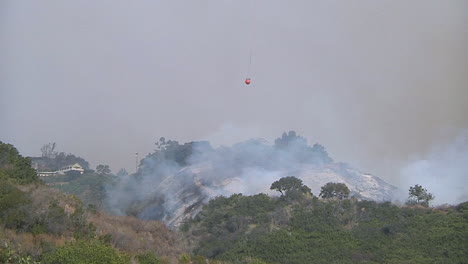 firefighting helicopters make water drops on the thomas fire in santa barbara california 1