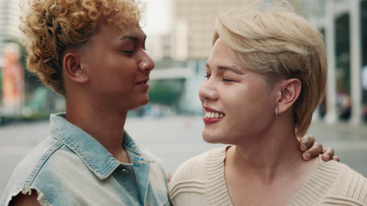 A loving LGBTQ couple embracing in the city