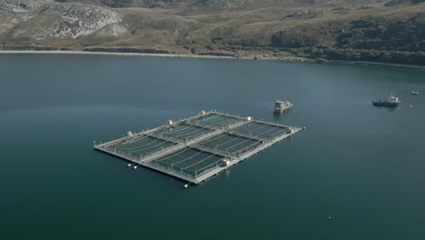 an aerial view of an aquaculture installation on loch eriboll in the scottish highlands on a sunny day