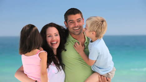 family posing in front of the camera