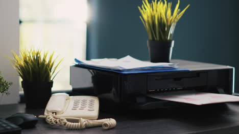 Company-documents-on-table-in-accounting-department-workspace,-close-up