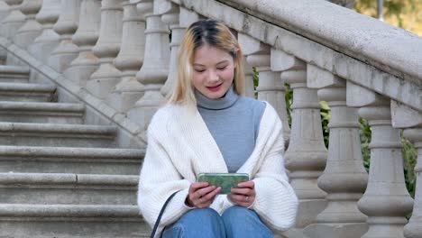 Woman-enjoying-the-outdoors-while-using-her-cellphone