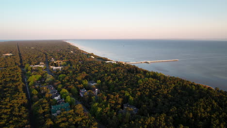 aerial over hel peninsula shows iconic wooden pier, jurata, baltic coast, poland