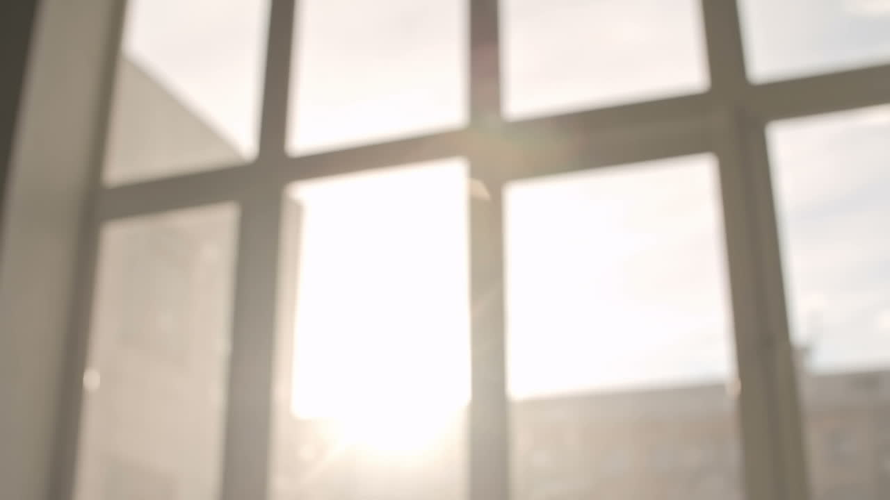 Close Up View Of Shaking Hands With Window In The Background At Sunset